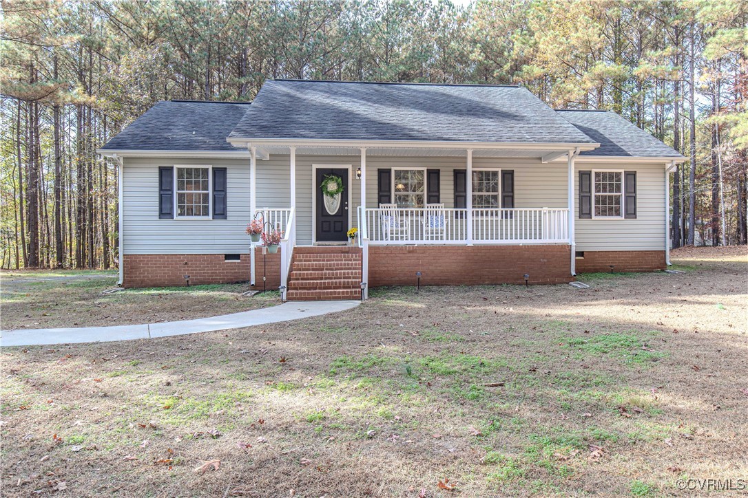 9595 Holdsworth Road Disputanta, VA 23842 - Photo 1 of 28 a front view of a house with a yard