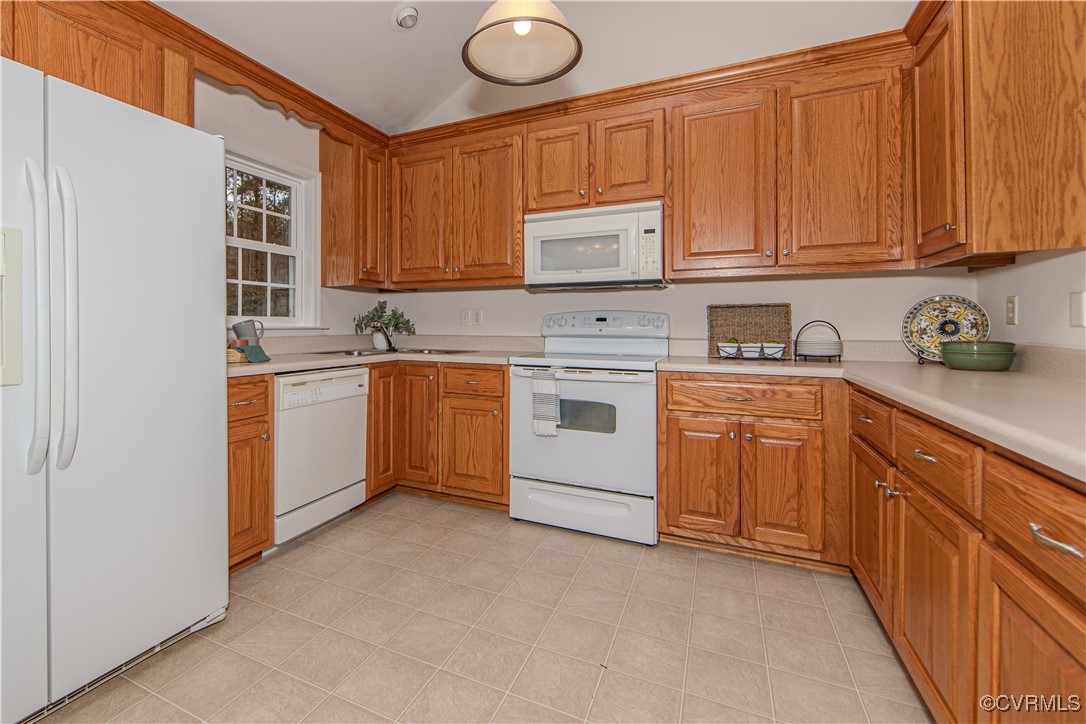 9595 Holdsworth Road Disputanta, VA 23842 - Photo 12 of 28 a kitchen with stainless steel appliances granite countertop a sink stove and cabinets