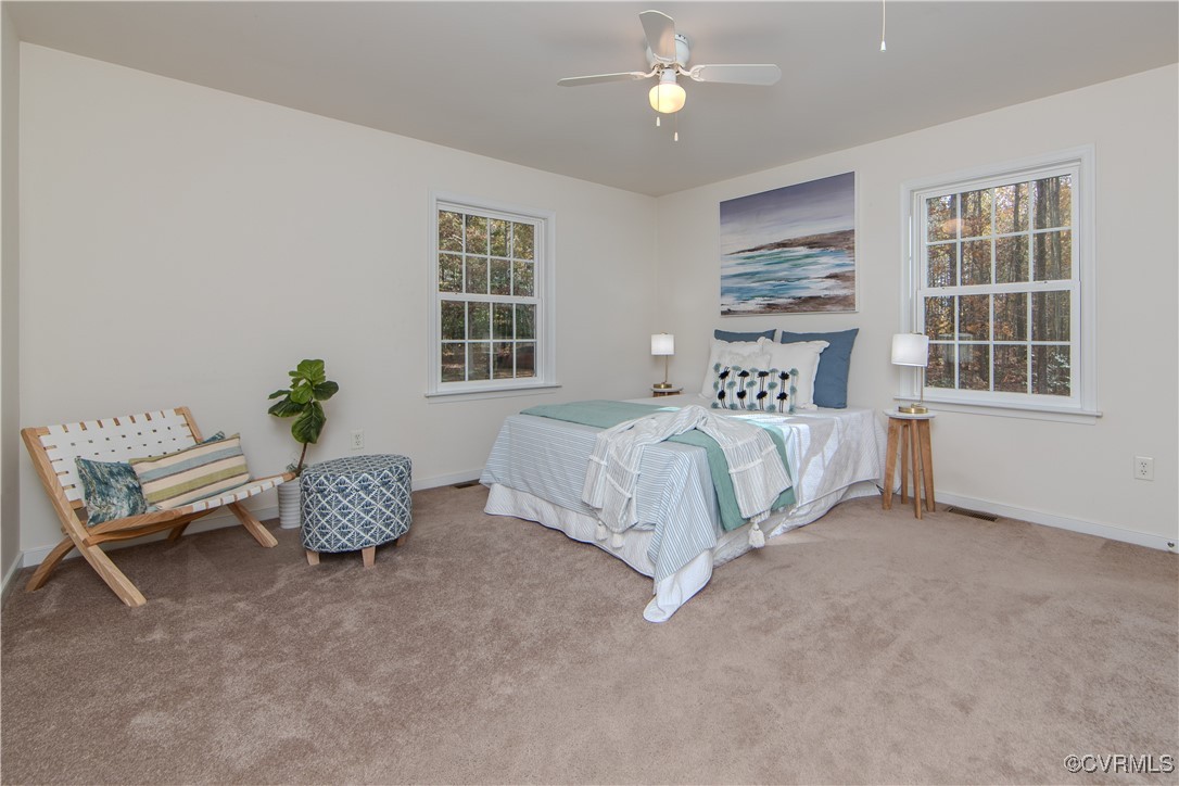 9595 Holdsworth Road Disputanta, VA 23842 - Photo 14 of 28 a bedroom with a bed furniture and window
