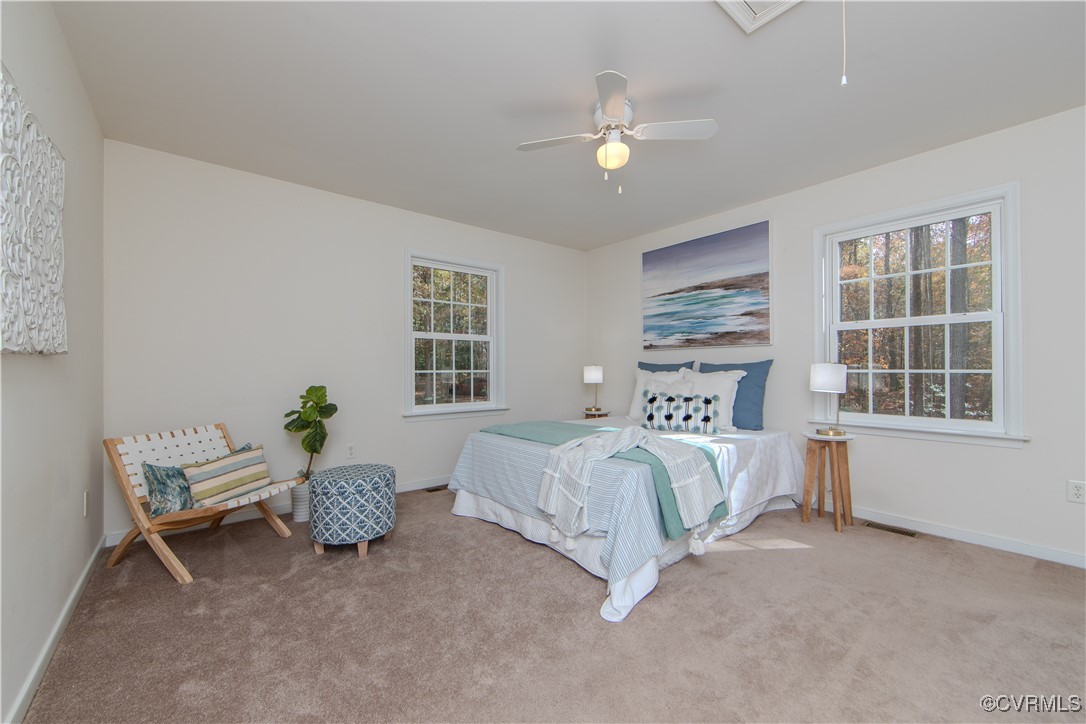 9595 Holdsworth Road Disputanta, VA 23842 - Photo 15 of 28 a bed room with a bed and a window