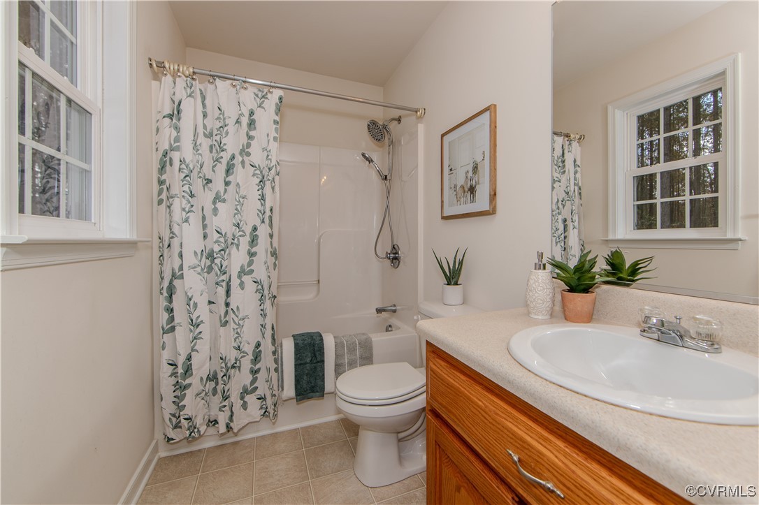 9595 Holdsworth Road Disputanta, VA 23842 - Photo 17 of 28 a bathroom with a sink toilet and shower