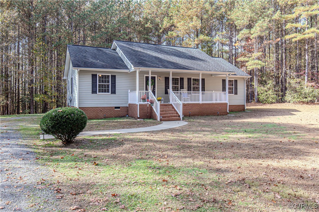 9595 Holdsworth Road Disputanta, VA 23842 - Photo 2 of 28 a view of a house with backyard and a tree