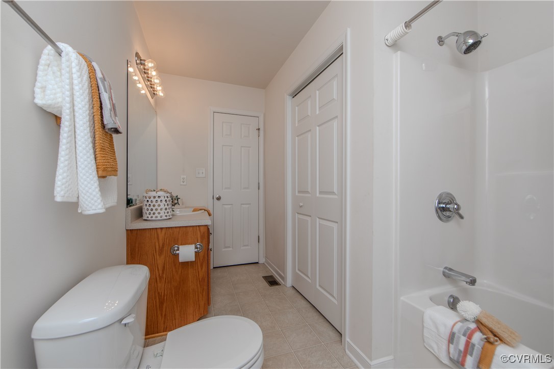 9595 Holdsworth Road Disputanta, VA 23842 - Photo 22 of 28 a bathroom with a toilet a sink and mirror