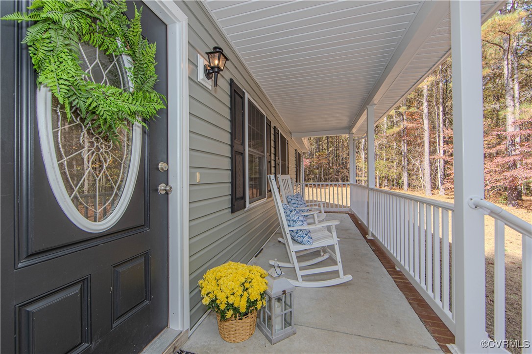 9595 Holdsworth Road Disputanta, VA 23842 - Photo 5 of 28 a view of a porch with furniture