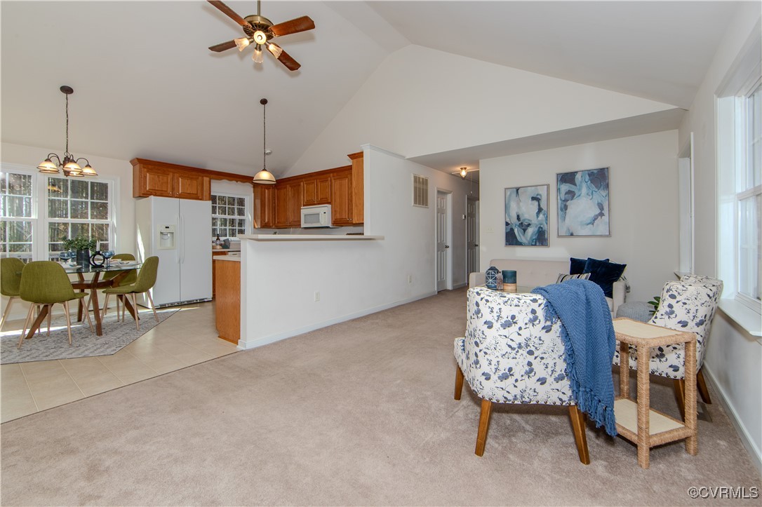 9595 Holdsworth Road Disputanta, VA 23842 - Photo 9 of 28 a living room with furniture and a chandelier