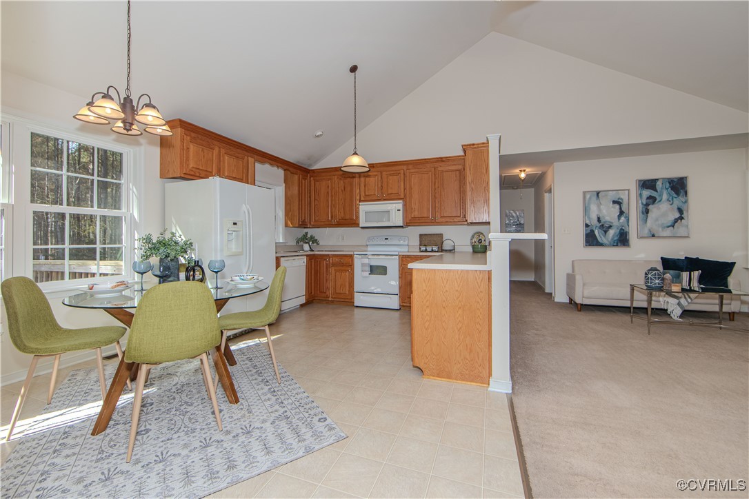 9595 Holdsworth Road Disputanta, VA 23842 - Photo 10 of 28 a view of a dining room with furniture and a chandelier