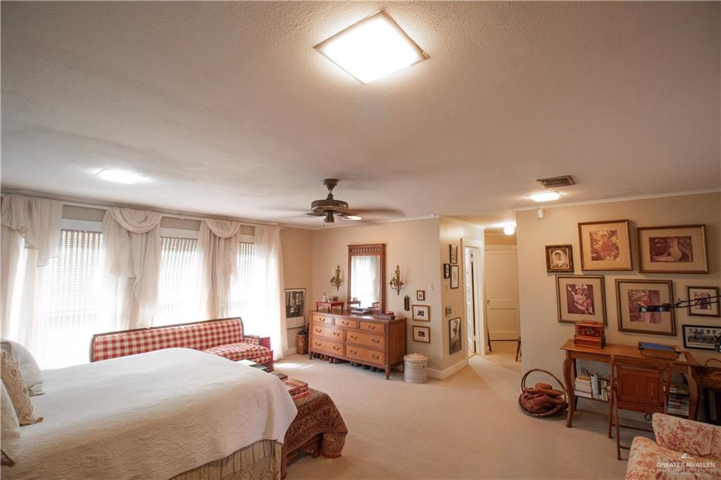 801 South River Road Donna, TX 78537 - Photo 15 of 35 a bedroom with a bed gym equipment and a large window