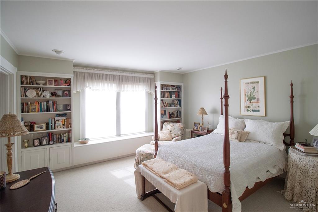 801 South River Road Donna, TX 78537 - Photo 19 of 35 a bedroom with a bed and large window
