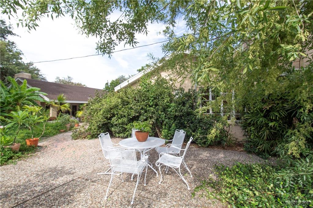 801 South River Road Donna, TX 78537 - Photo 22 of 35 a view of a patio with table and chairs and potted plants