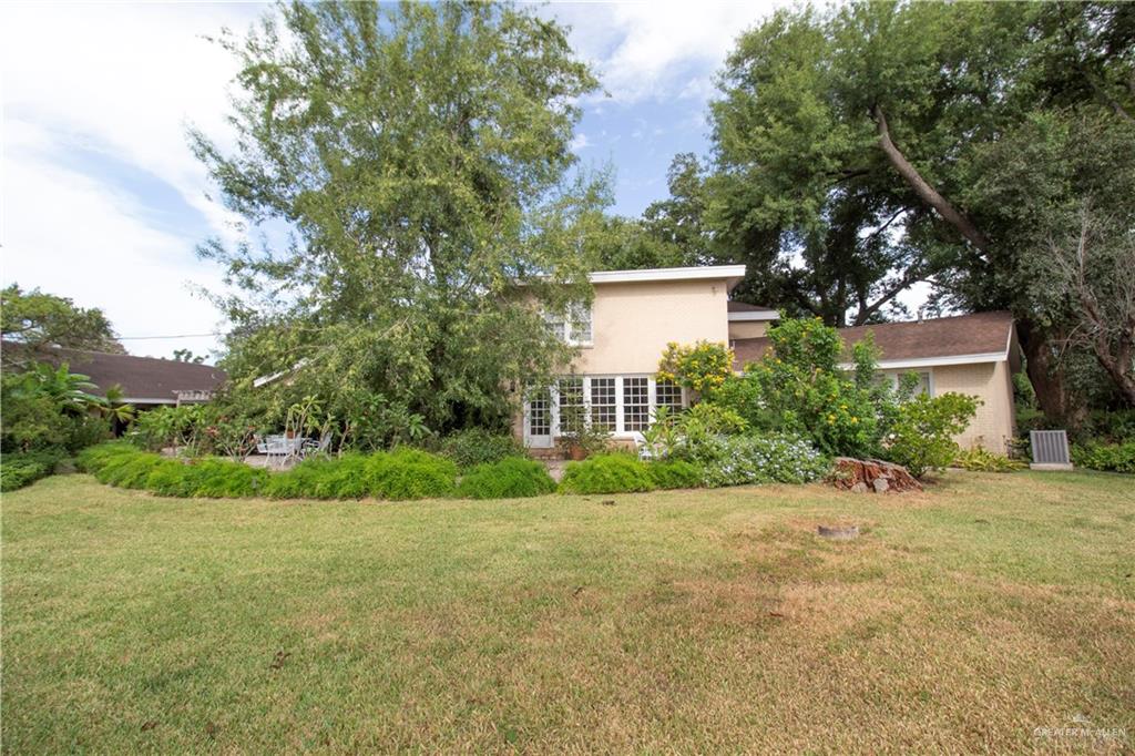 801 South River Road Donna, TX 78537 - Photo 25 of 35 a view of a house with a yard and large trees