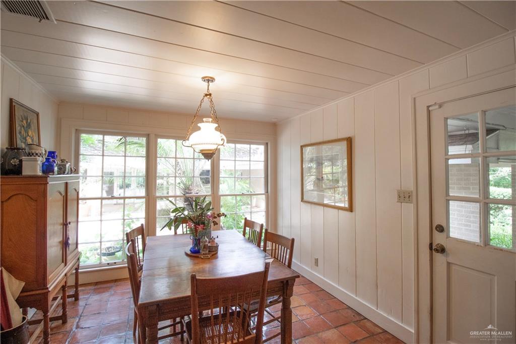 801 South River Road Donna, TX 78537 - Photo 10 of 35 a dining room with furniture a chandelier and wooden floor
