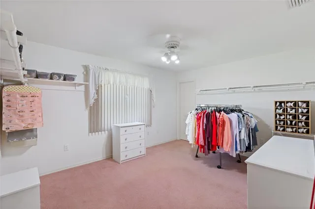 a view of a bedroom with closet area