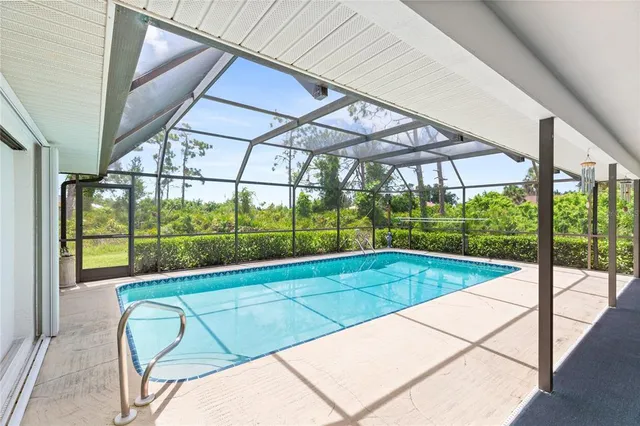 a view of a swimming pool with a lounge chairs