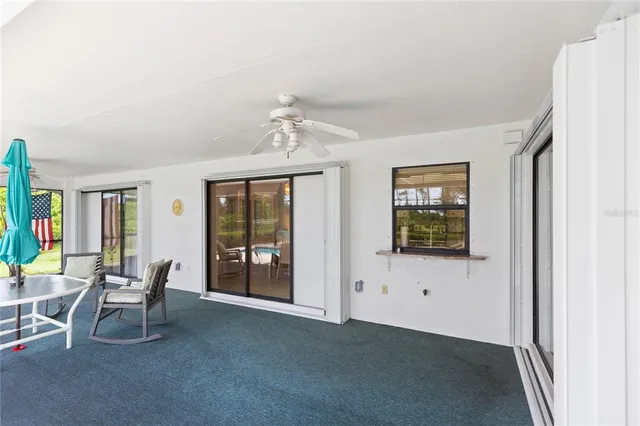 a view of a livingroom with furniture and windows