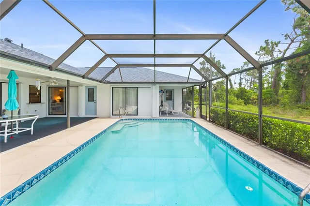 a view of swimming pool with a yard