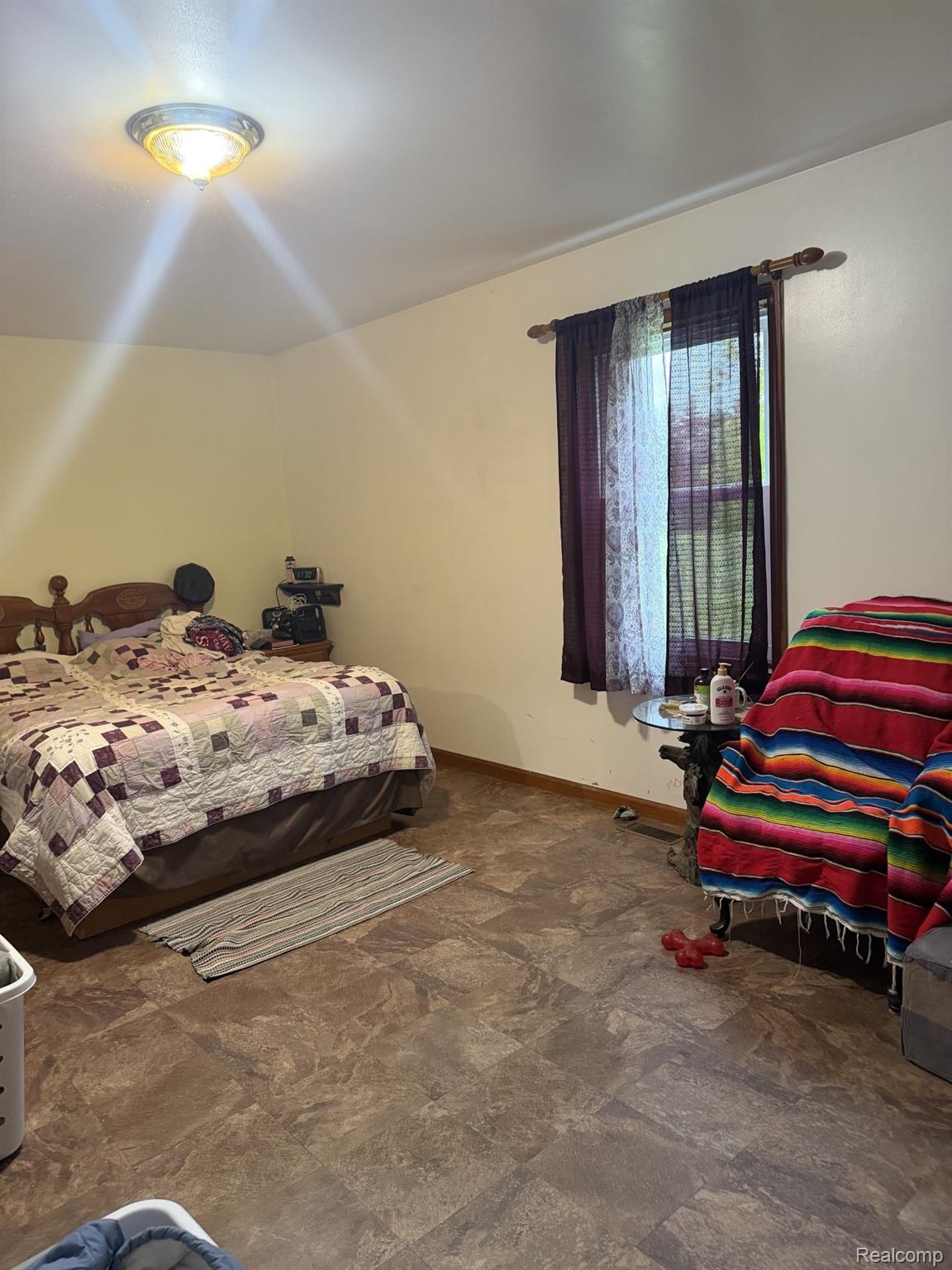 5200 Mayville Road Clifford, MI 48727 - Photo 10 of 17 Bedroom featuring baseboards and stone finish floors