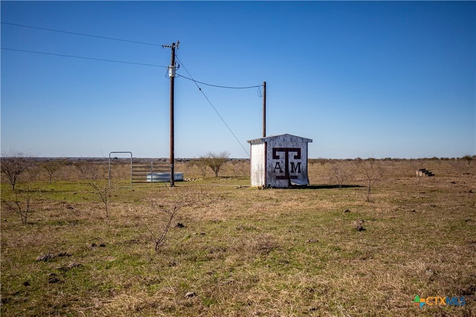 Lot 12 Concrete-Edgar Road Cuero, TX 77954 - Photo 3 of 7 View of grassy yard featuring a shed and a rural view