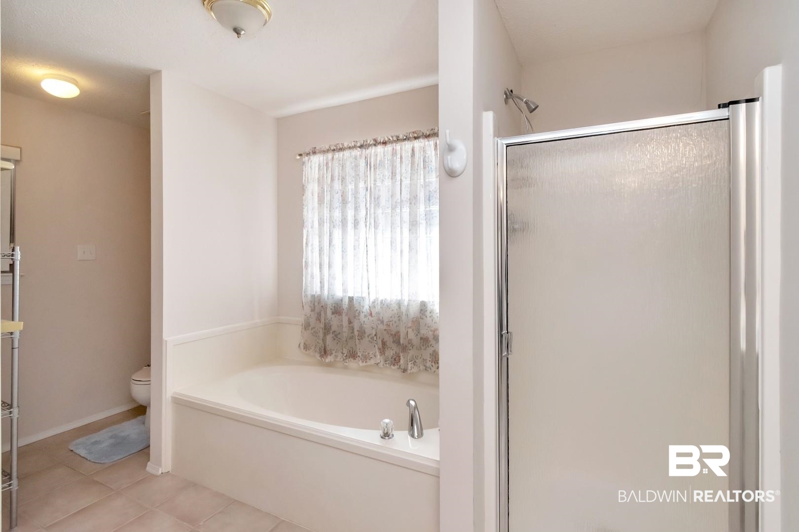 8221 Woodbend Drive Semmes, AL 36575 - Photo 22 of 35 Bathroom featuring toilet, tile patterned floors, and plus walk in shower