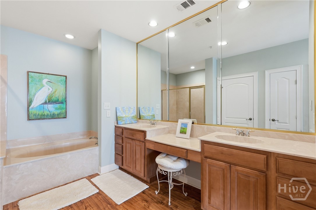 214 Butler Avenue, Unit 306 Tybee Island, GA 31328 - Photo 23 of 49 Double vanity sinks with separate garden tub in Primary Bathroom