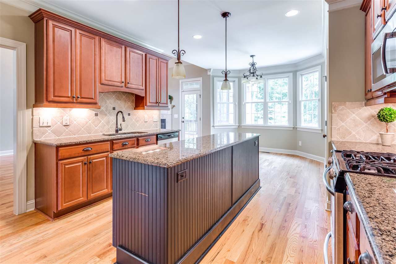 3509 Griffice Mill Road Raleigh, NC 27610 - Photo 9 of 20 A great kitchen to entertain with. Stainless appliances, tile back splash and easy access to family room and screened porch. Kitchen