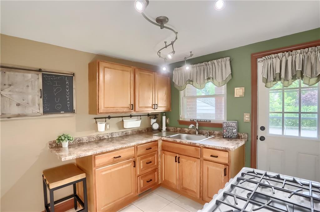 301 Wright Street McKees Rocks, PA 15136 - Photo 11 of 27 a kitchen with a sink stove and cabinets