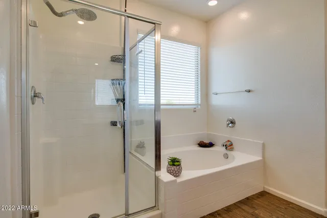 a bathroom with a bathtub and shower