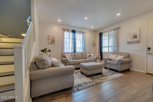 a living room with furniture and a window