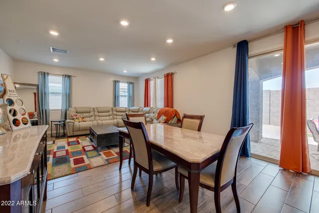 a view of a dining area with furniture and a window