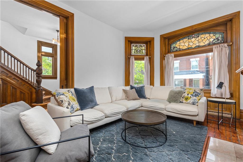 243 Fisk Street Pittsburgh, PA 15201 - Photo 11 of 34 a living room with furniture and a large window