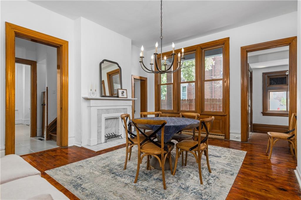 243 Fisk Street Pittsburgh, PA 15201 - Photo 14 of 34 a view of a dining room with furniture window and wooden floor