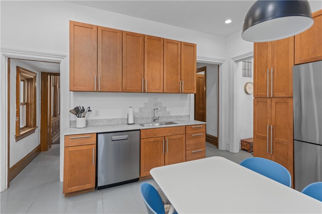 243 Fisk Street Pittsburgh, PA 15201 - Photo 22 of 34 a kitchen with a sink appliances and cabinets