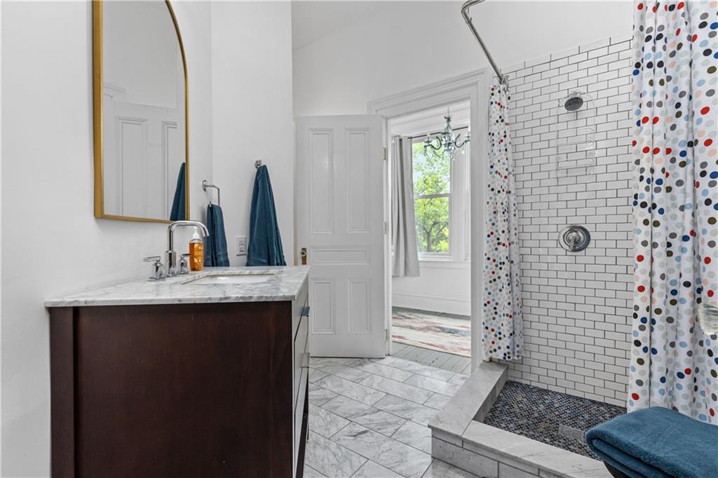 243 Fisk Street Pittsburgh, PA 15201 - Photo 25 of 34 a bathroom with a sink toilet and shower
