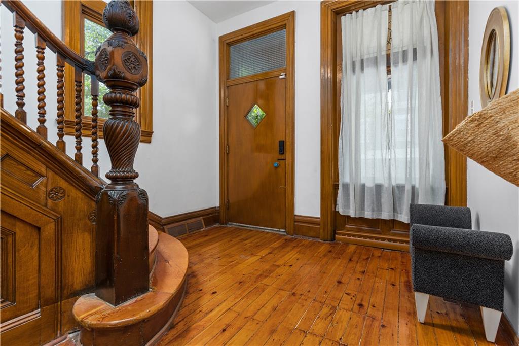 243 Fisk Street Pittsburgh, PA 15201 - Photo 9 of 34 a view of an entryway with wooden floor and door