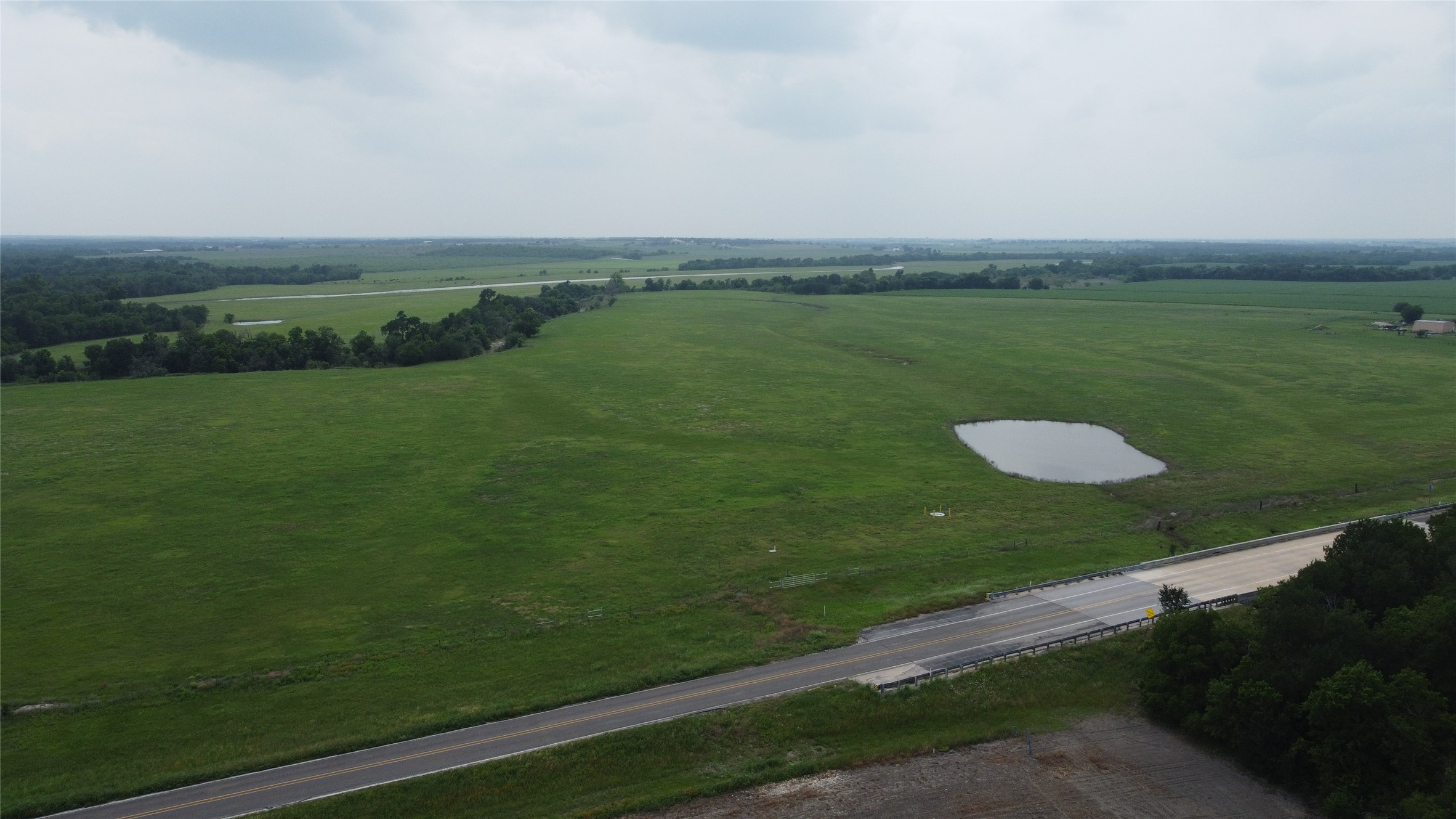 0 Fm 112 Road Thrall, TX 76578 - Photo 3 of 38 a view of a golf course with a lake