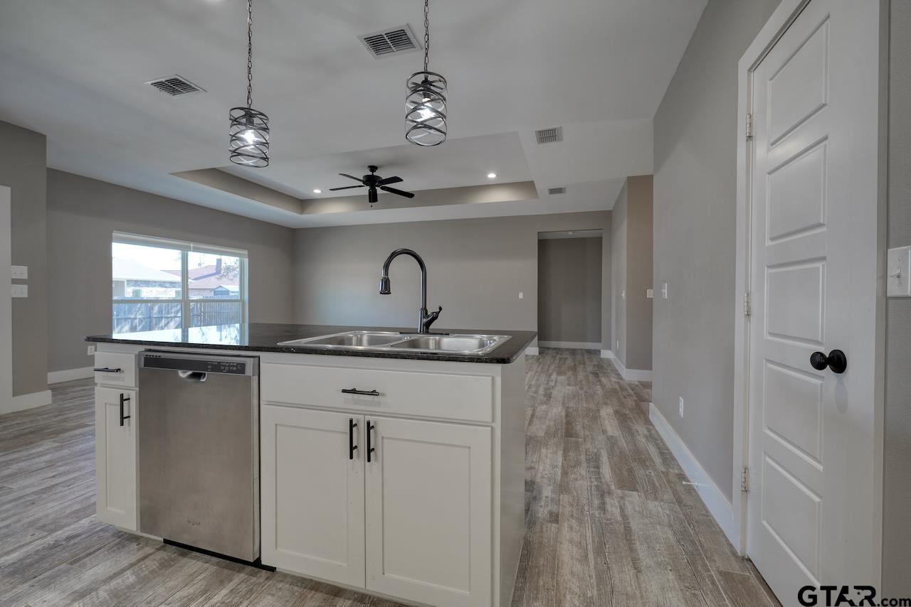 15342 Spring Oaks Drive Lindale, TX 75771 - Photo 18 of 45 a bathroom with a sink double vanity granite and a mirror