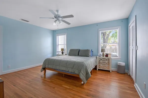 a bedroom with a bed and a dresser