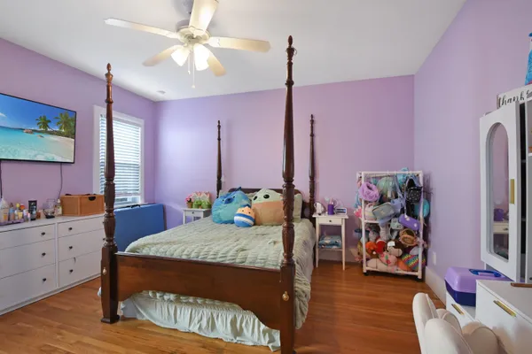 a bed room with a bed and a flat screen tv