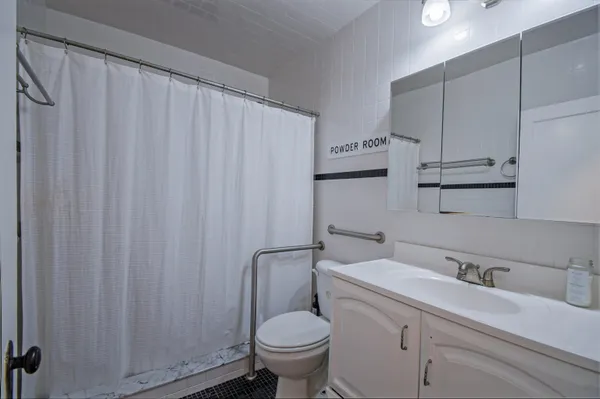 a bedroom with a bed and dresser