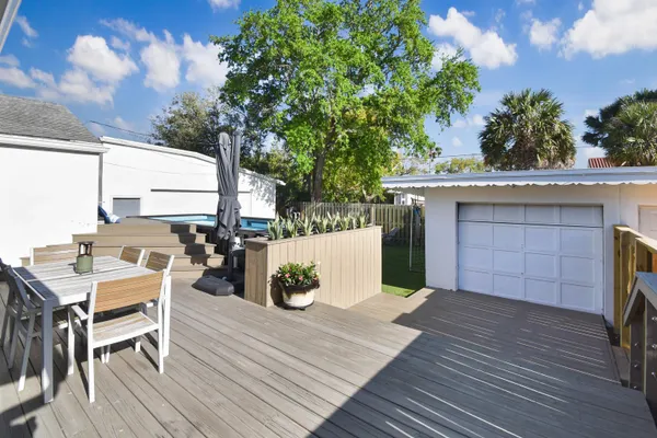 a view of a house with a large tree
