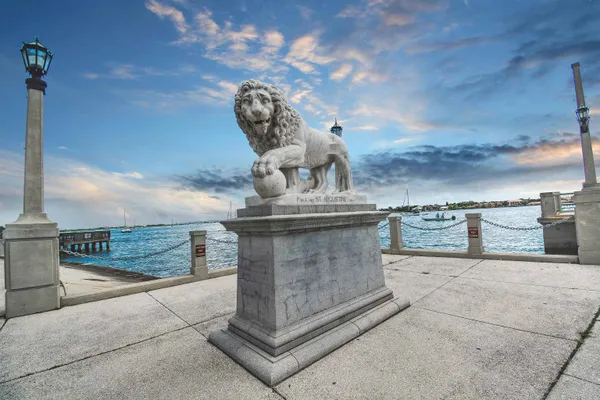 a view of a water fountain in front of a house