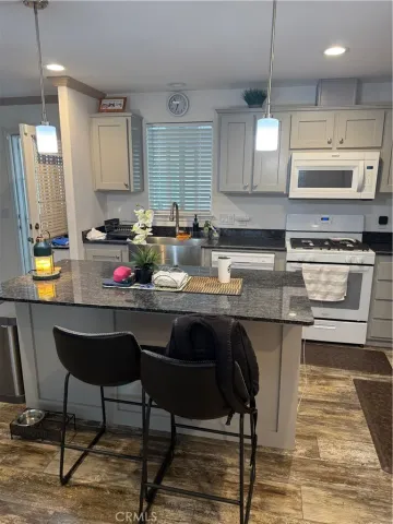 a kitchen with a sink cabinets and window