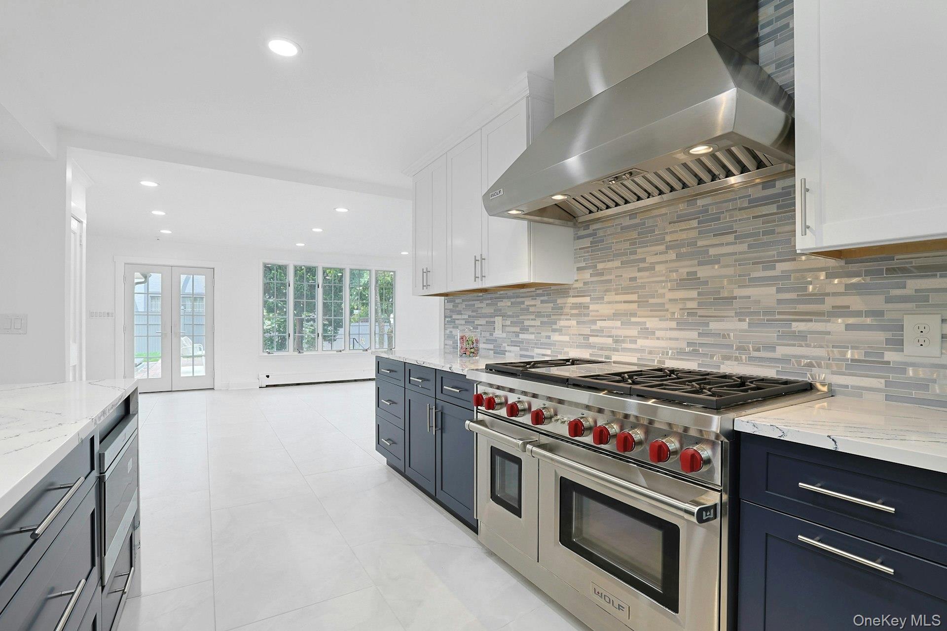 14 Withington Road Scarsdale, NY 10583 - Photo 13 of 41 a kitchen with granite countertop a stove and a sink