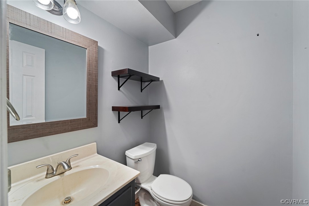 12031 Bundle Road Chesterfield, VA 23838 - Photo 34 of 43 a bathroom with a sink toilet and mirror
