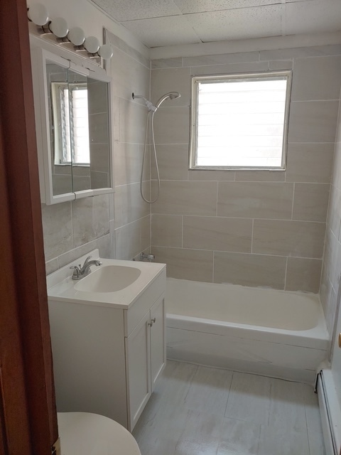 14613 Keystone Avenue Midlothian, IL 60445 - Photo 13 of 16 a bathroom with a sink toilet and shower