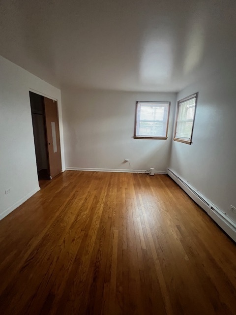 14613 Keystone Avenue Midlothian, IL 60445 - Photo 15 of 16 a view of empty room with wooden floor and fan