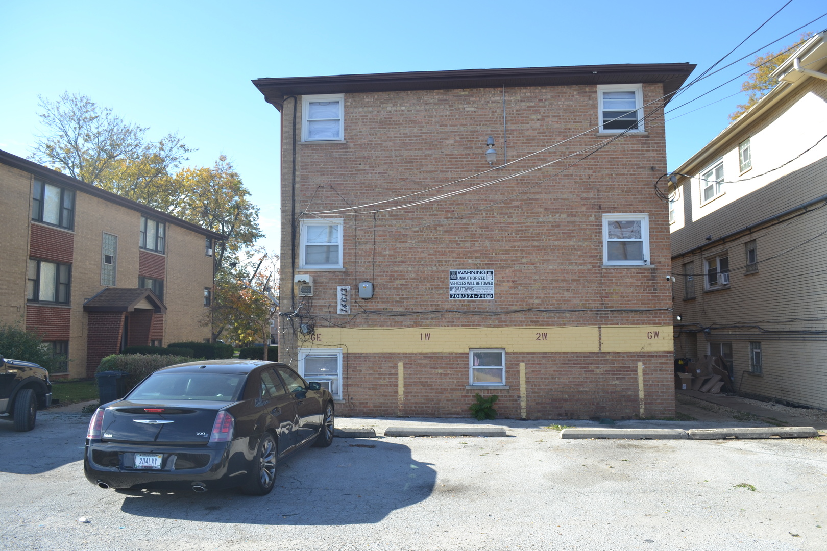 14613 Keystone Avenue Midlothian, IL 60445 - Photo 3 of 16 a car parked in front of a brick building
