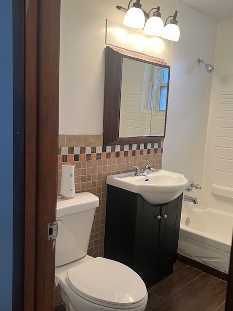 14613 Keystone Avenue Midlothian, IL 60445 - Photo 6 of 16 a bathroom with a sink vanity granite and toilet