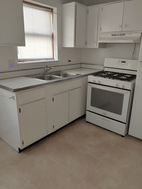 14613 Keystone Avenue Midlothian, IL 60445 - Photo 8 of 16 a kitchen with granite countertop white cabinets and white stainless steel appliances
