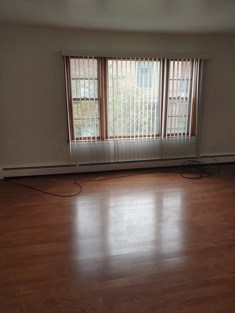 14613 Keystone Avenue Midlothian, IL 60445 - Photo 10 of 16 a view of empty room with wooden floor and fan