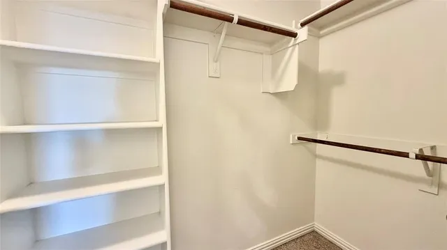 a bathroom with a double vanity sink a mirror and a shower